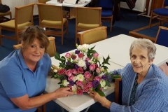 Maureen presenting Cathie with the display.